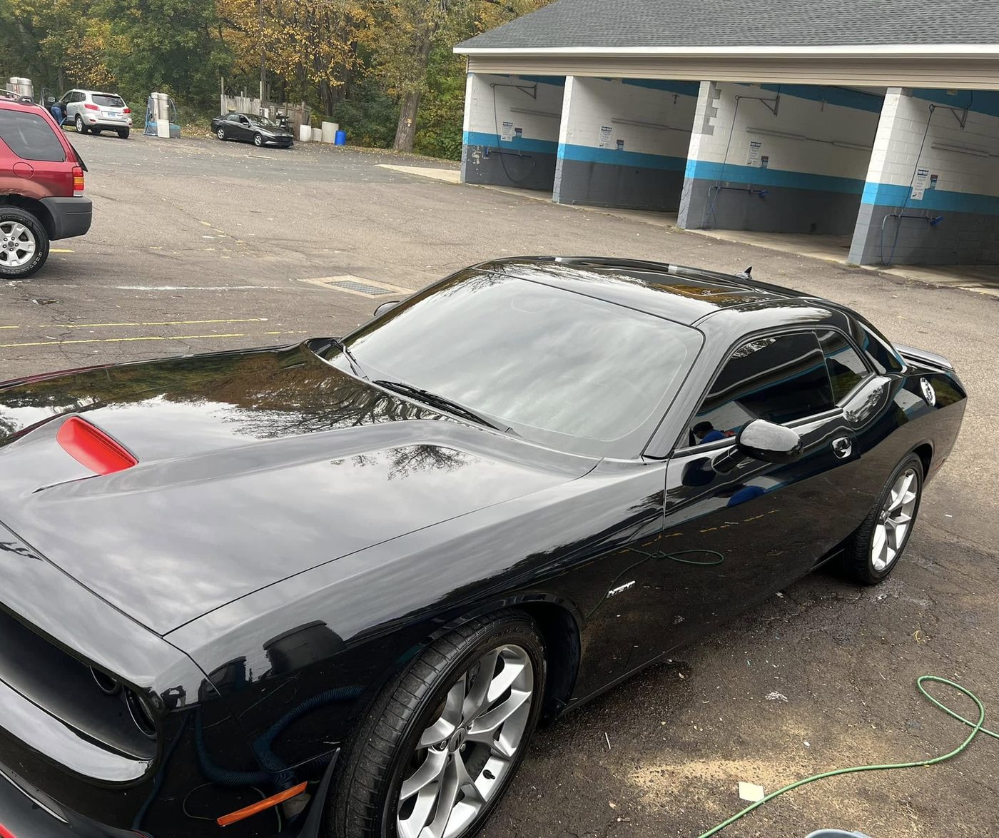 Black Dodge Challenger with tinted windows