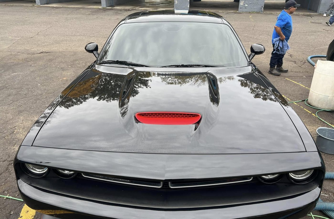 Black Dodge Challenger detailed and tinted