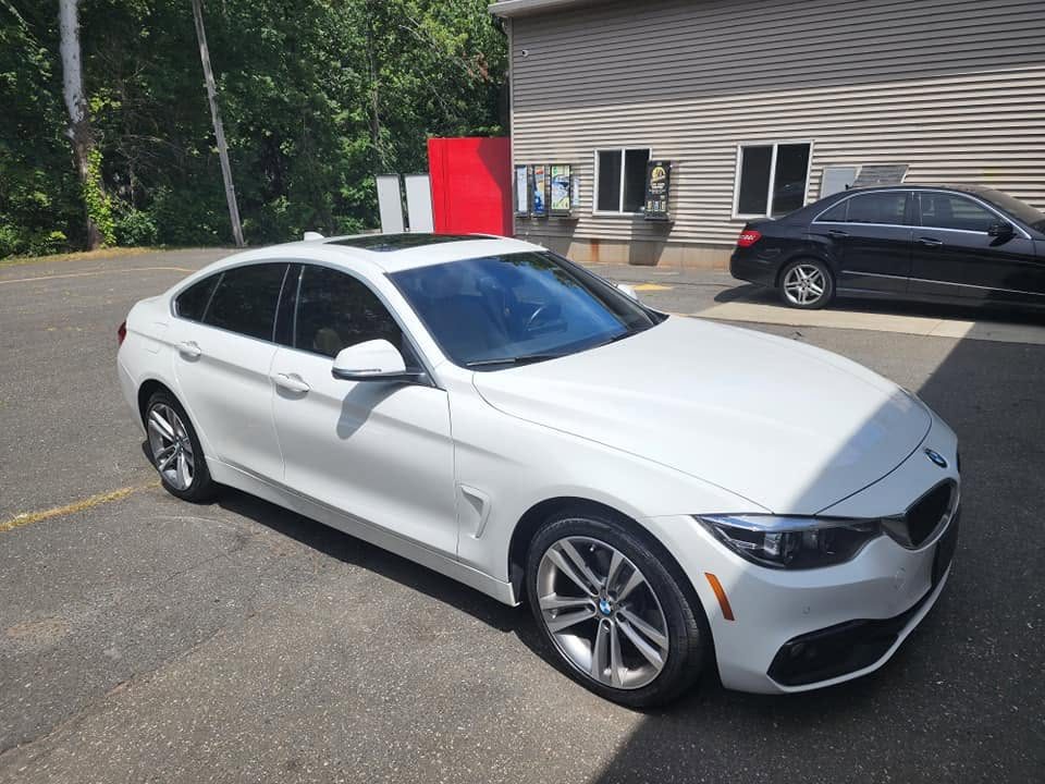 White BMW with 15 percent window tint